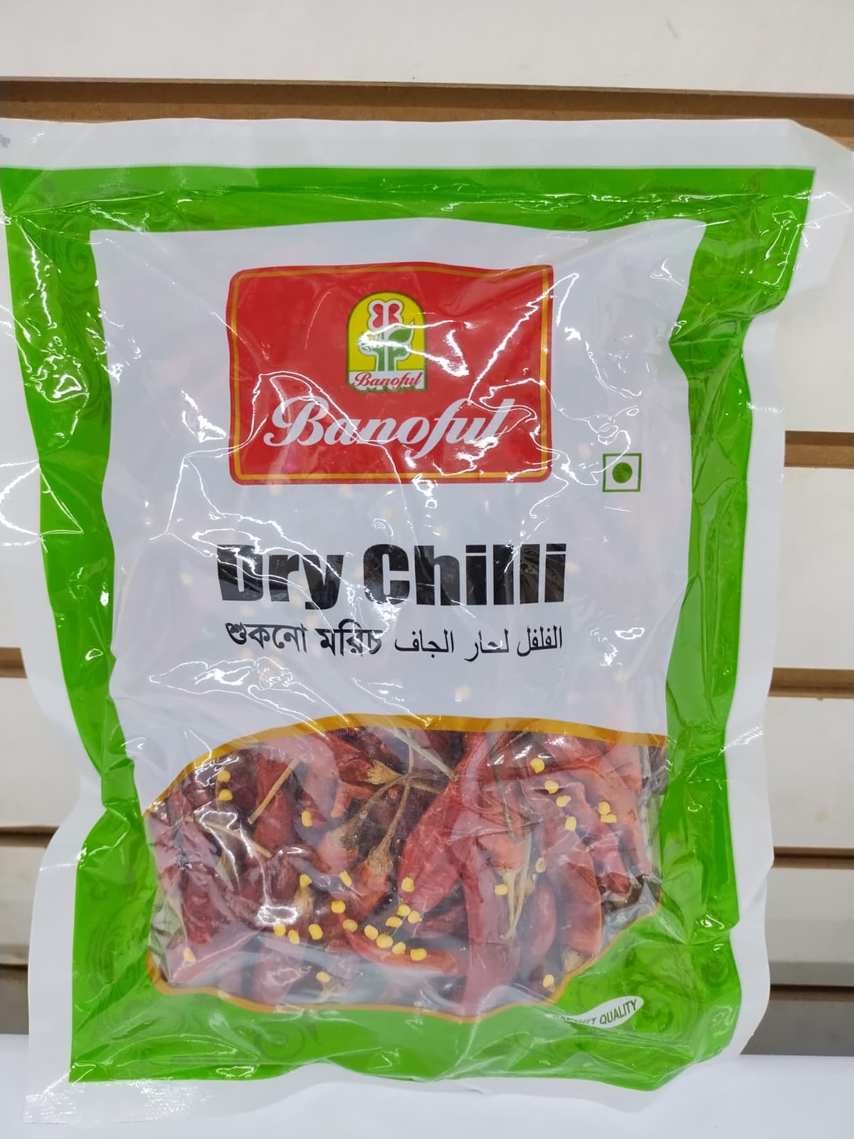 A bag of Banoful Dry Chilli paste, featuring a white and green packaging design with a clear window showing dried red chili peppers inside.