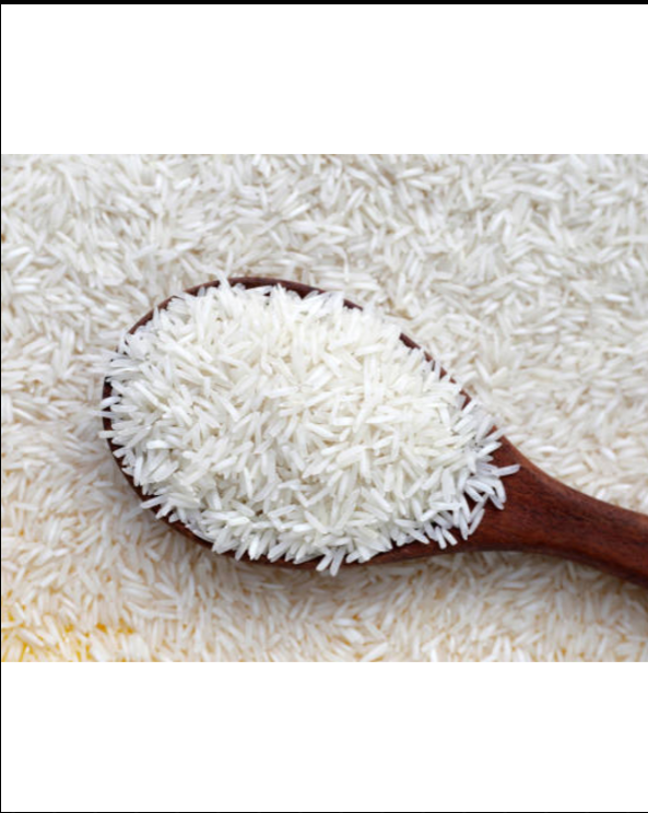 Wooden spoon filled with white rice on a bed of rice