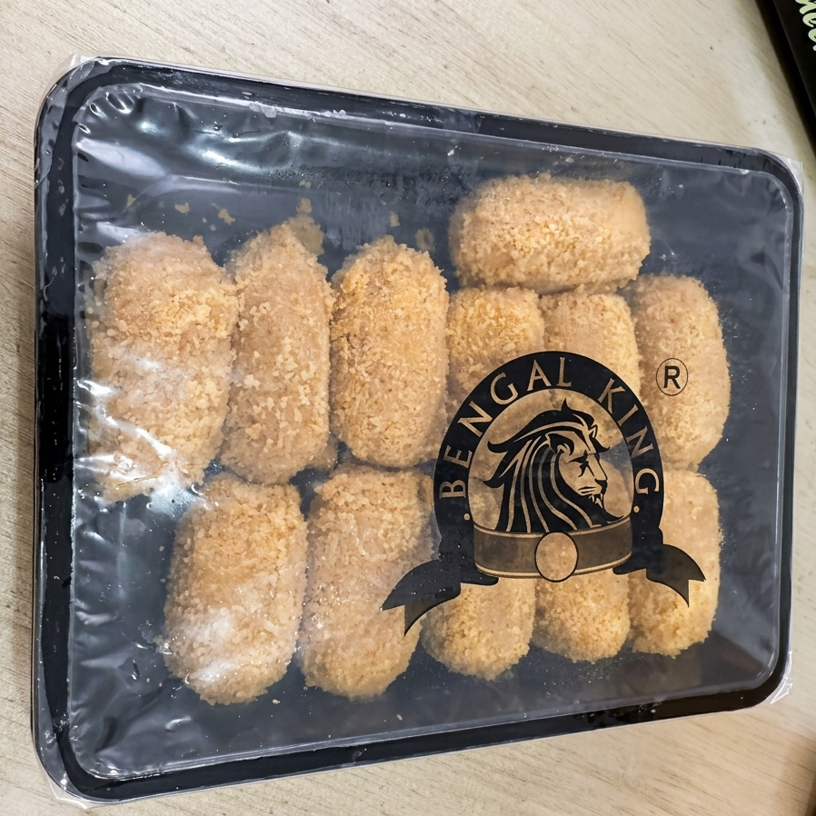 Packaged food items with Bengal King logo on a light wooden surface