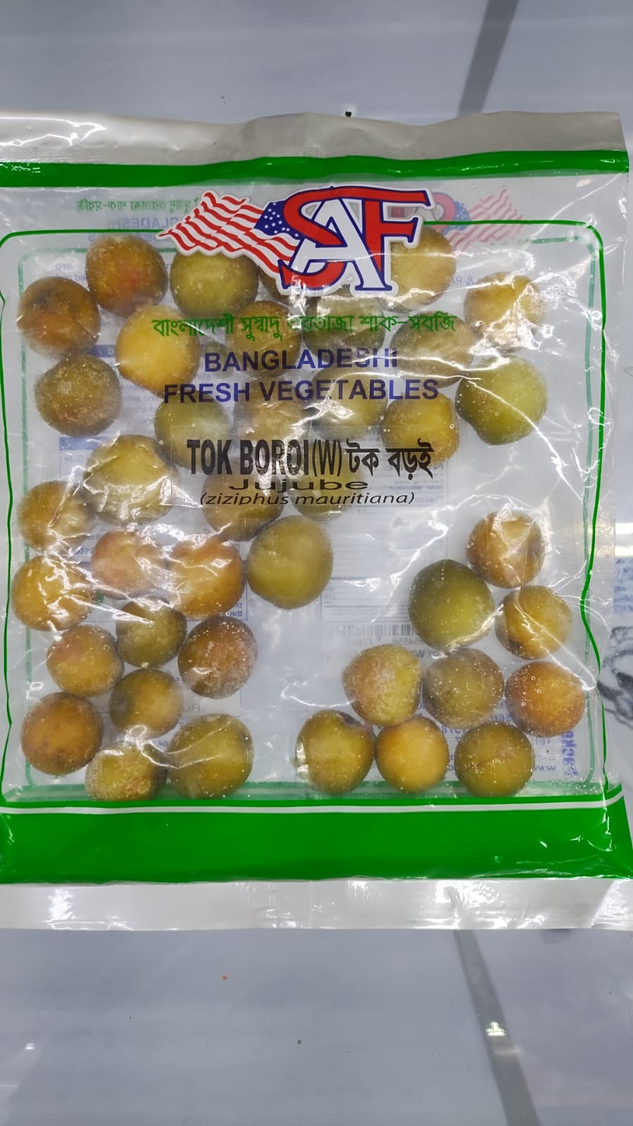 Packaged vegetables with a brand label on a white background
