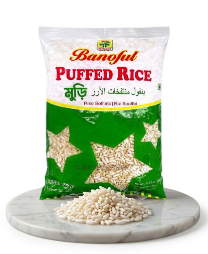 A bag of Banful Puffed Rice on a white background, with a small pile of the rice displayed on a round marble board in front of the package.