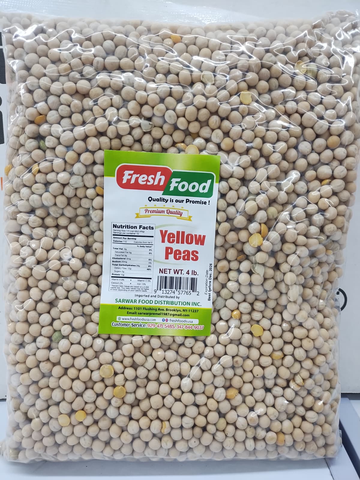 A clear plastic bag filled with yellow peas, featuring a green and white 'Fresh Food' brand label on the front.