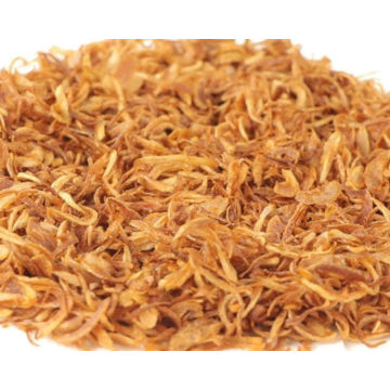 Close-up of a pile of dried onions on a white background