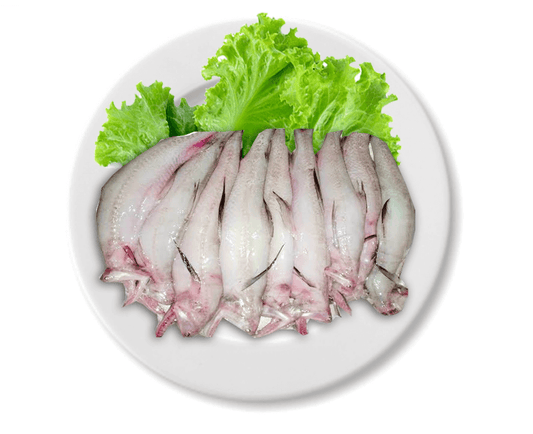 Raw loitta on a white plate with green lettuce leaves