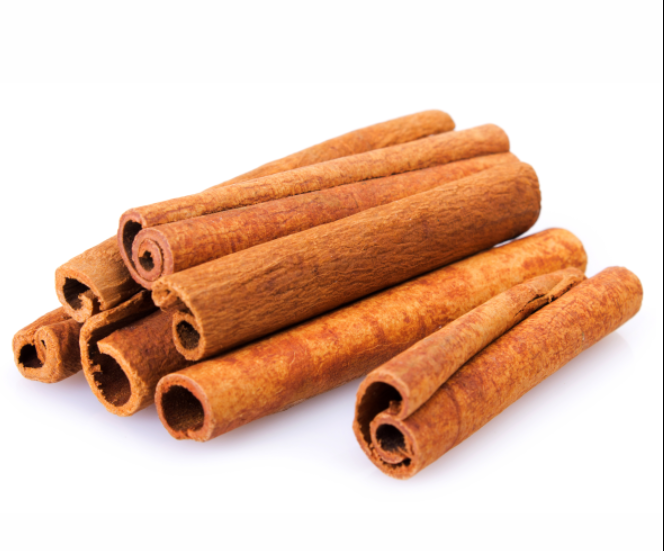Stack of cinnamon sticks on a white background