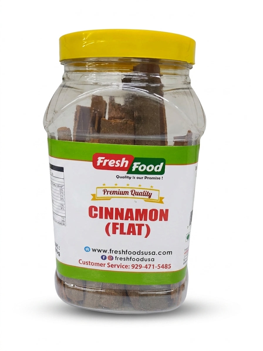 A clear plastic jar of Fresh Food brand Cinnamon (Flat) on a white background, featuring a yellow lid and a white label with green and red accents.