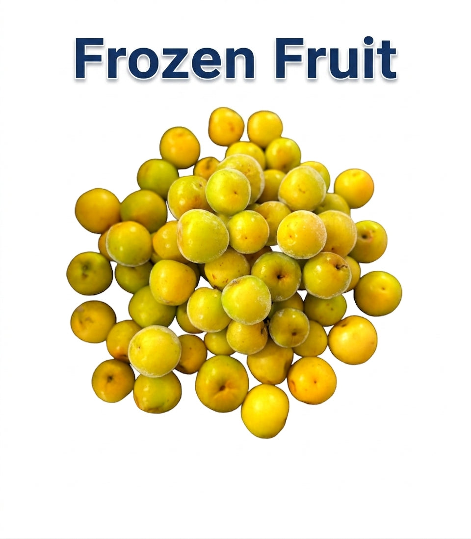 A pile of frozen yellow-green fruit pieces, likely citrus segments or small pomelo/grapefruit halves, shown on a white background with the text 'Frozen Fruit' above them.