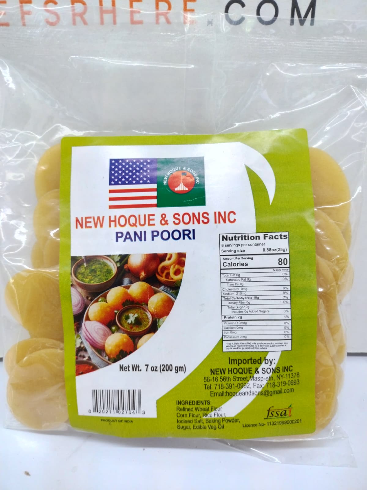 A 7 oz package of New Hoque & Sons Inc. Pani Poori (cabbage rolls) in clear plastic packaging with a green and white label, displayed on a white surface.