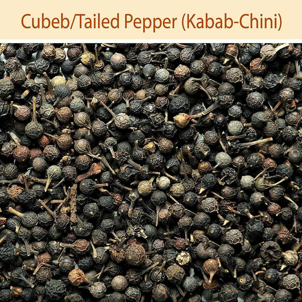 Close-up of Cubeb/Tailed Pepper (Kabab-Chini) with a beige background and text.