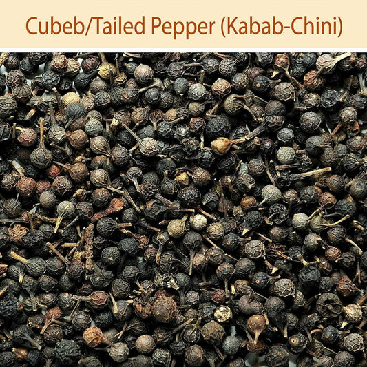 Close-up of Cubeb/Tailed Pepper (Kabab-Chini) with a beige background and text.
