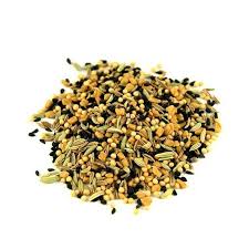 Heap of dried herbs on a white background