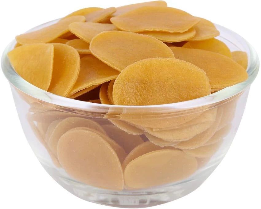 A clear glass bowl filled with golden brown Pani Puri (Fuchka) snack cakes.