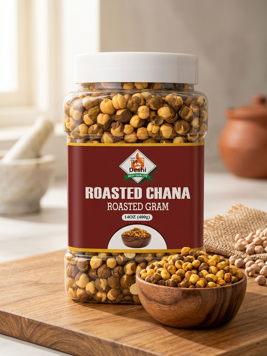 A clear plastic jar of Deshi Roasted Chana (roasted gram) with a white lid and a dark red label, displayed on a wooden cutting board with a small wooden bowl of the chickpeas and a rustic background.