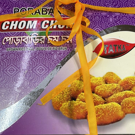 Packaged food product with a purple label and yellow ribbon, featuring Tatka branding.