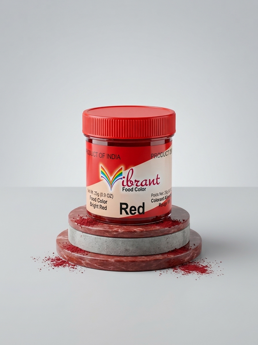 A jar of Vibrant Food Color Red sugar free food color, displayed on a stack of marble plates with red powder scattered around, on a light gray background.