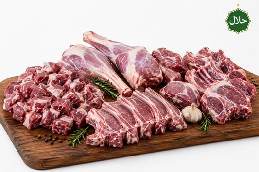 Raw zabiha halal whole baby goat meat cuts on a wooden board with a white background